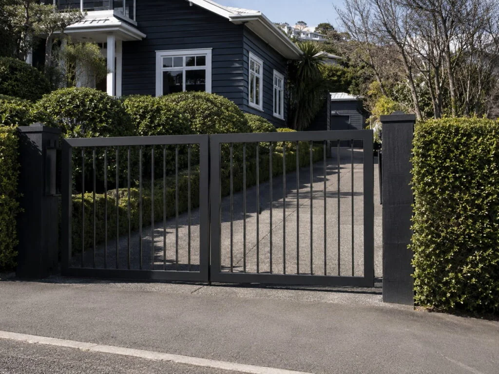 Black automatic driveway gate at a Wellington home