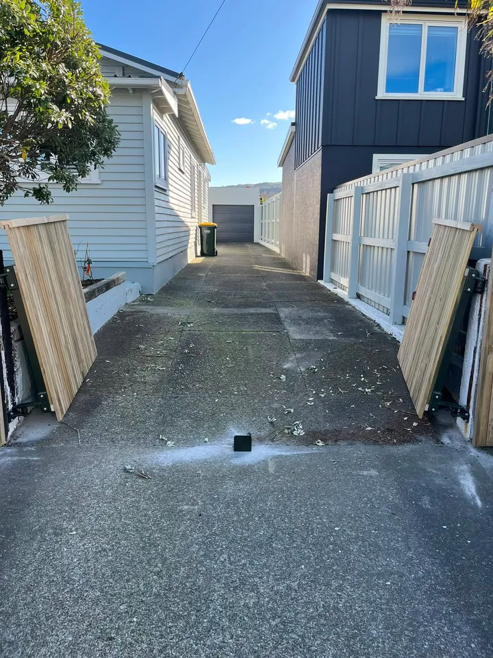 Timber fence panels framing a Wellington driveway entrance